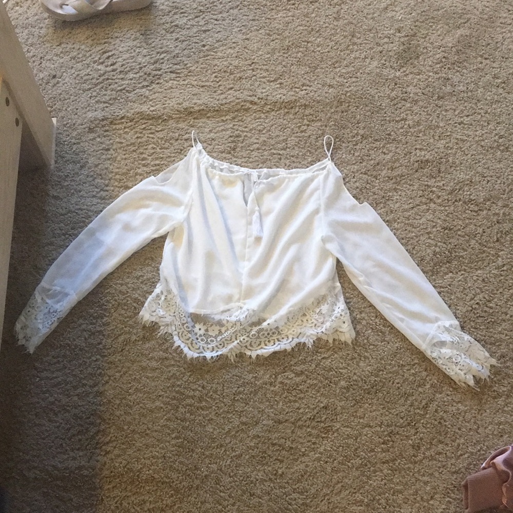 A sheer long sleeve top